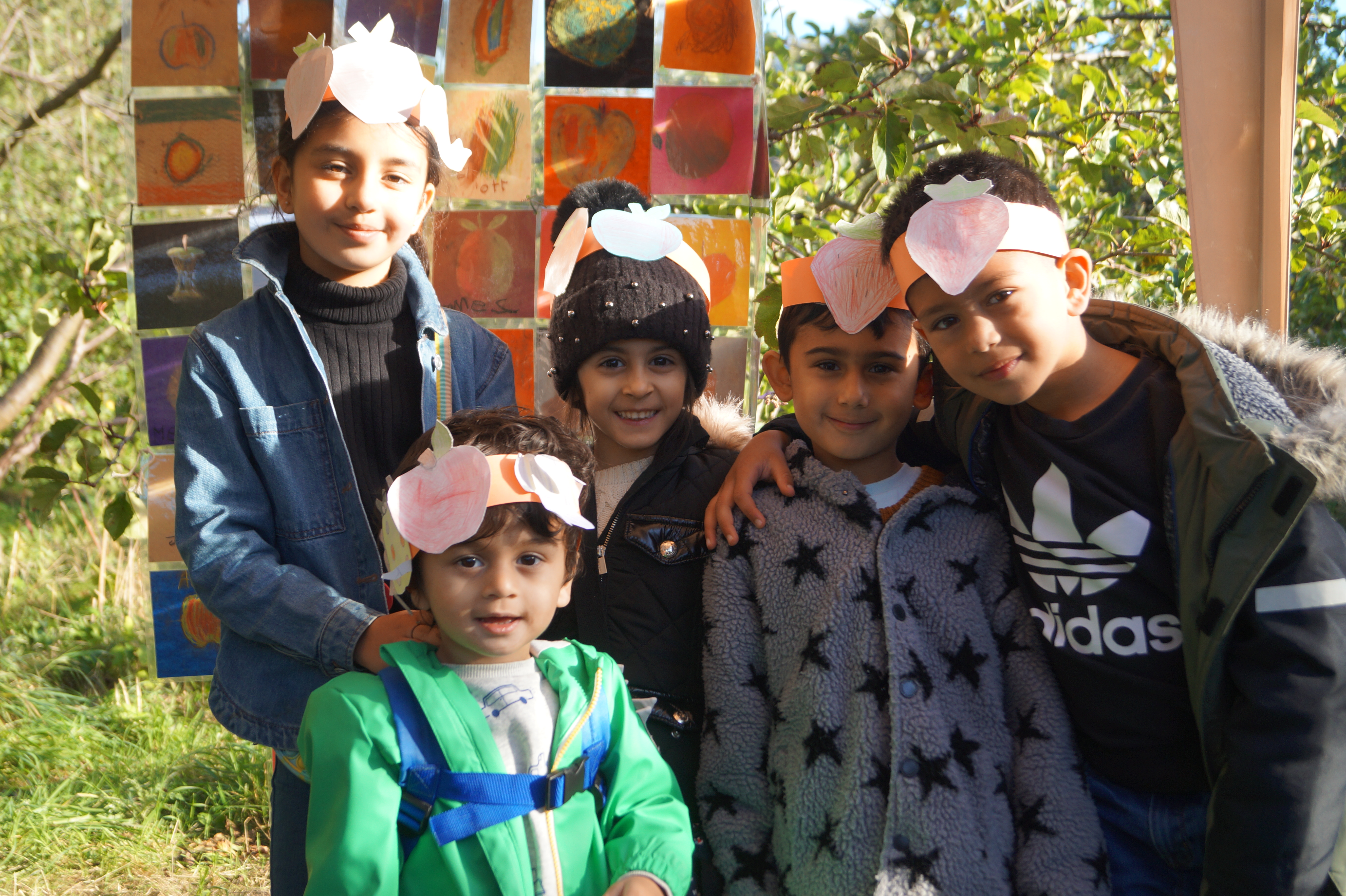 group of children wearing card crowns they have made